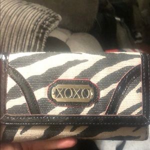 A black an white xoxo wallet
